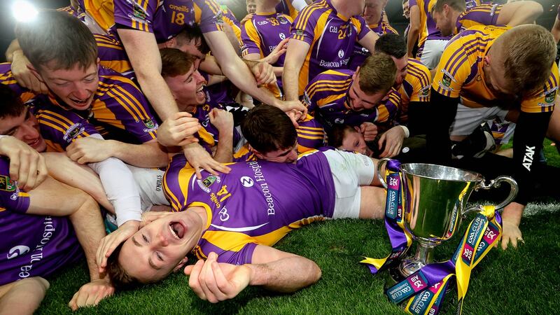 Shane Cunningham celebrates with teammates after capturing the Leinster crown. Photograph: Ryan Byrne/Inpho