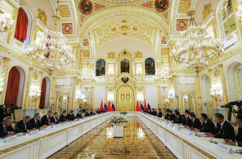 Russian president Vladimir Putin, China's president Xi Jinping and members of their delegations hold a meeting at the Kremlin in Moscow on Tuesday. Photograph: Sergei Karkuphin/Sputnik/AFP via Getty Images