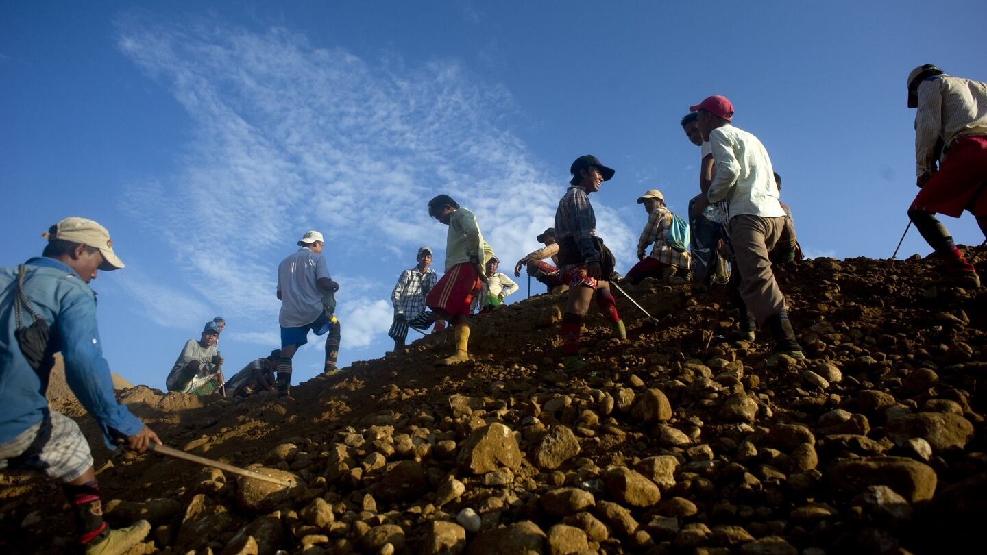 Jade trade: freelance miners search rubble for the stone; Myanmar’s jade trade is reputed to be worth about half of the country’s gross domestic product. Photograph: Ye Aung Thu/AFP/Getty