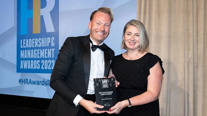 David Casey, wellness and health promotion manager, DeCare, presents the most effective rewards & benefits strategy award to Orla McCarron, ICON