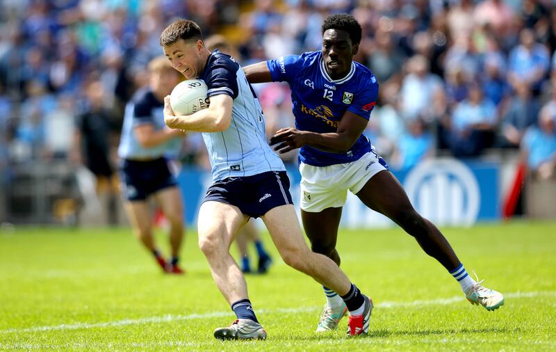 Cavan’s Emmanuel Shehu and Cormac Costello of Dublin in action. Photograph: Ryan Byrne/Inpho 