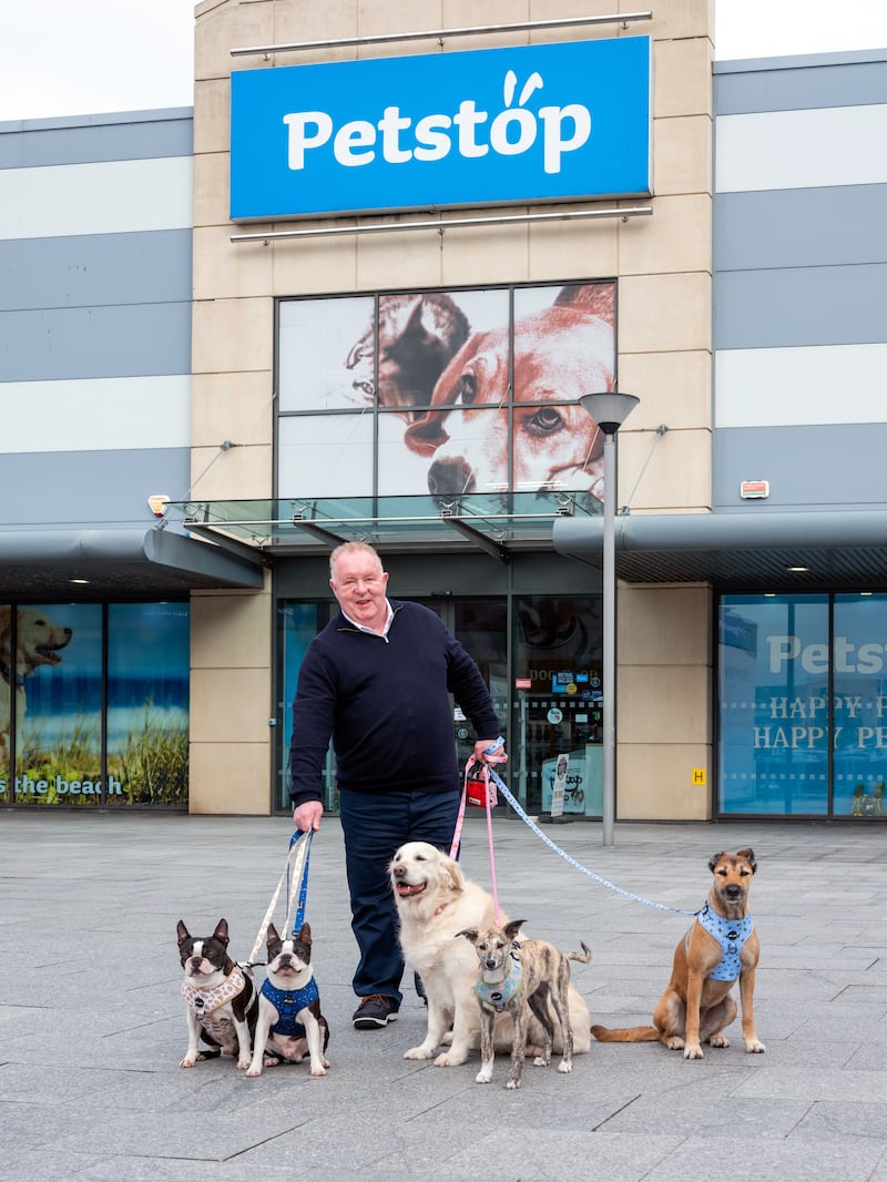 Anthony Gallagher outside the Carrickmines store with Henry and George, Anthony's dog, Bev, and staff dogs Pickles and Ruby