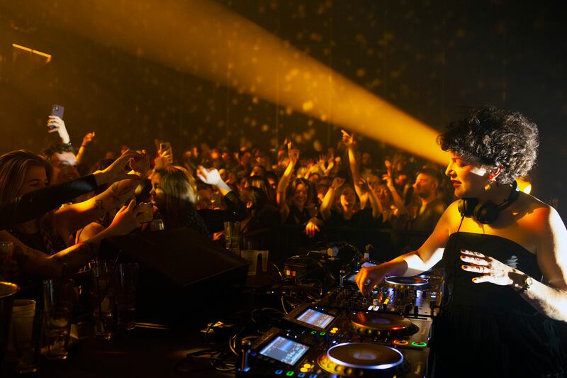 Annie Macmanus, who DJs as Annie Mac, during her set at a Before Midnight party in London. The Before Midnight parties promise all the thrills of a hedonistic night out, but with a respectable finish time for older dance music fans. Photograph: Lauren Fleishman/The New York Times