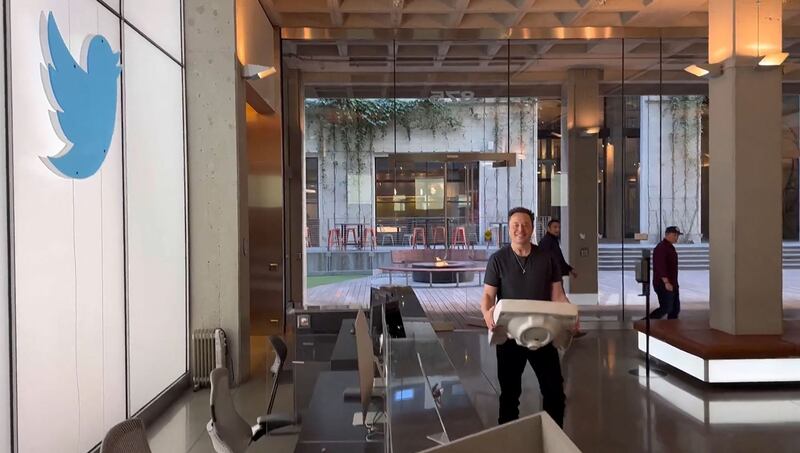 Elon Musk carrying a sink as he enters the Twitter headquarters in San Francisco. Photograph: AFP/Getty