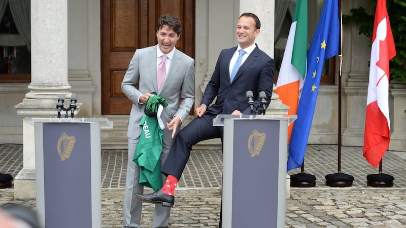 Justin Trudeau, Prime Minister of Canada is presented with an Ireland rugby jersey and socks from An Taoiseach Leo Varadkar at Farmleigh House, Dublin. Photograph: Dara Mac Dónaill / The Irish Times