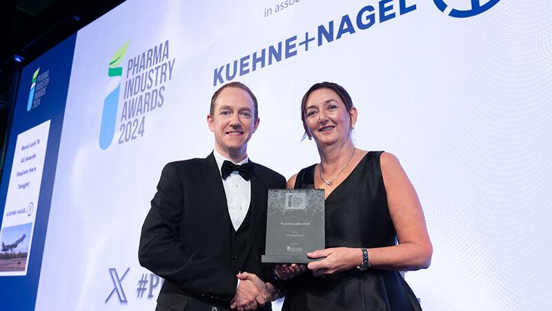 Liam Comerford, project manager / quantity surveyor of Asgard Clean Rooms, presents the Pharma Leader 2024 to Alice Redmond
