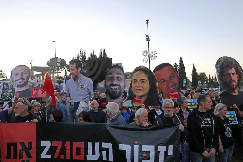 People gather outside the Knesset, Israel's parliament in Jerusalem, to mark the third anniversary of Hamas' October 7th, 2023, attack. Photograph: Ahmad Gharabli/Getty Images