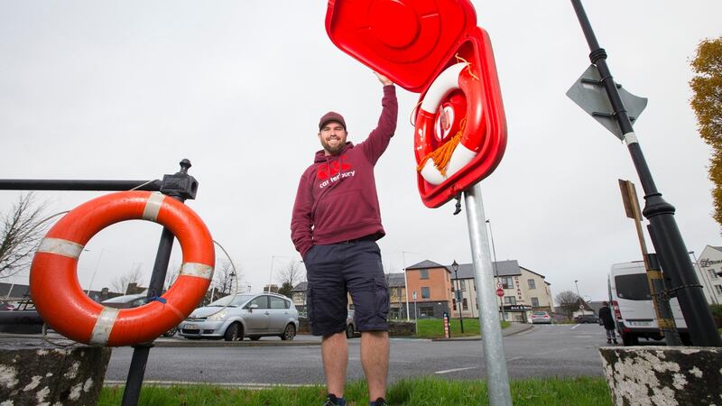 Daniel Mee with a  lifebuoy in place at Carrick-on-Shannon. Photograph Brian Farrell