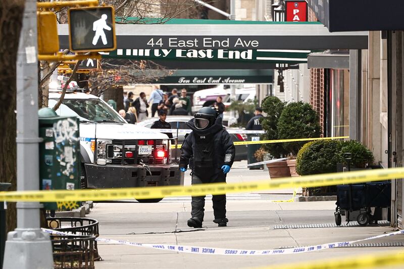 A NYPD officer wearing an Explosive Ordonance Disposal (EOD) suit investigates a scene a few blocks from Gracie Mansion, the official residence of New York Mayor Zohran Mamdani, after a homemade explosive thrown near anti-Muslim protesters failed to detonate. Photo: Charly Triballeau/AFP via Getty Images
