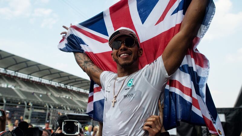 Lewis Hamilton celebrates winning the Formula One drivers’ championship during the Mexican Grand Prix last week. Photograph: PA