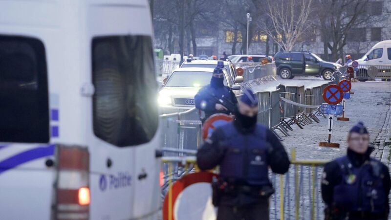 Police officers stand guard as vehicles arrive at the Palais de Justice courthouse in Brussels, on Monday. Photograph: Thierry Roge/AFP/Getty Images