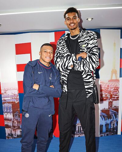 Double scoring trouble: France international Kylian Mbappe alongside basketball prodigy Victor Wembanyama at last month's NBA draft.