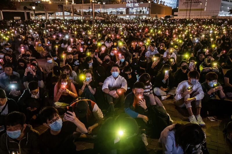 Demonstrators shine lights from smartphones during a rally at Edinburgh Place in the Central district of Hong Kong on Thursday.  Photograph: Justin Chin/Bloomberg