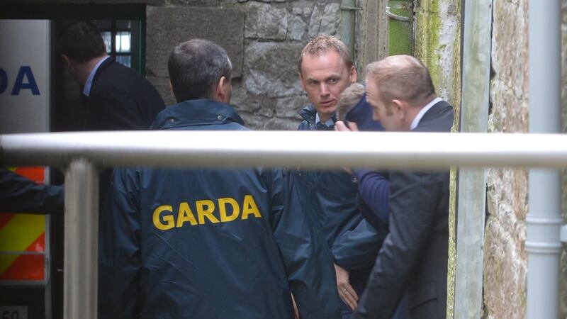 Ross Outram is led from Dungarvan Court after being charged with murder of Paddy Lyons. Photograph: Michael Mac Sweeney/Cork Courts.
