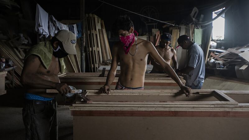 Workers at a funeral home make coffins in Managua, Nicaragua, on May 20th. Photograph: Inti Ocon/The New York Times