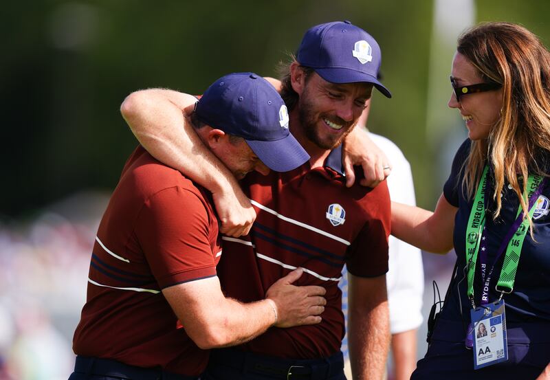 Rory McIlroy and Tommy Fleetwood celebrate winning their foursomes match 3&2 against Harris English and Collin Morikawa. Photograph: David Davies/PA