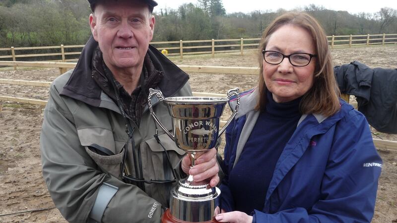 Bob Mayne receiving the Conor Walsh Memorial Cup from Marie Holmes Walsh for his catch of the first salmon on EMAA waters of 2019