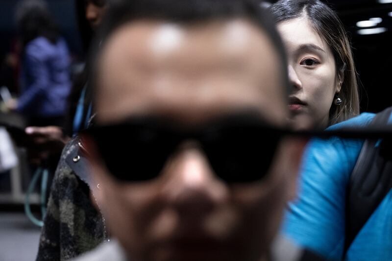 A person tries an augmented reality product from Xreal. Photograph: Brendan Smialowski/AFP via Getty