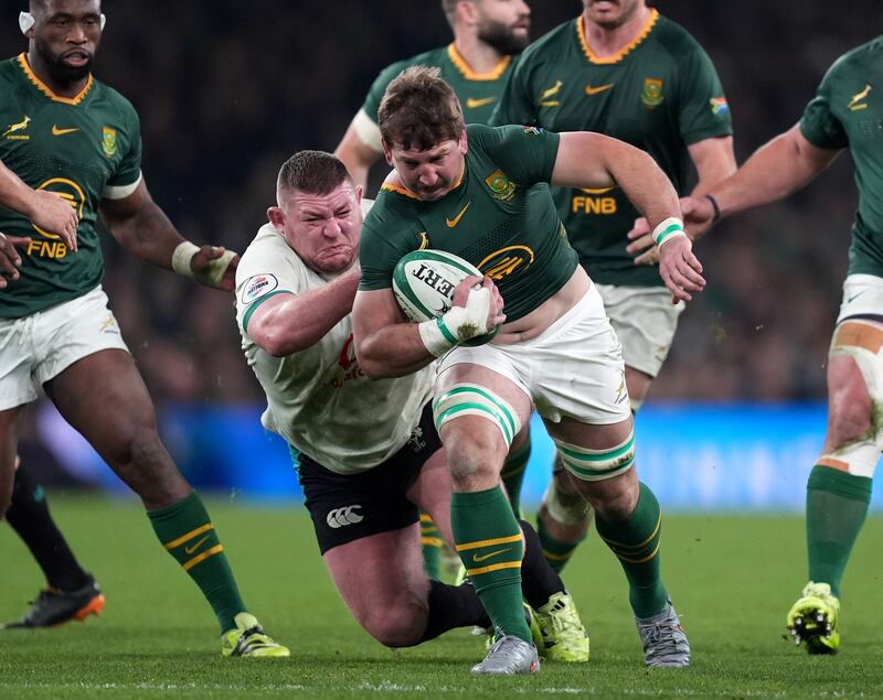 South Africa's Kwagga Smith (right) is tackled by Ireland's Tadhg Furlong. Photograph: Niall Carson/PA