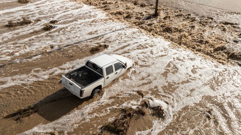 A vehicle is stranded as floodwaters wash out East Palmdale Boulevard in Sun Village, California. Photograph: Ted Soqui/EPA