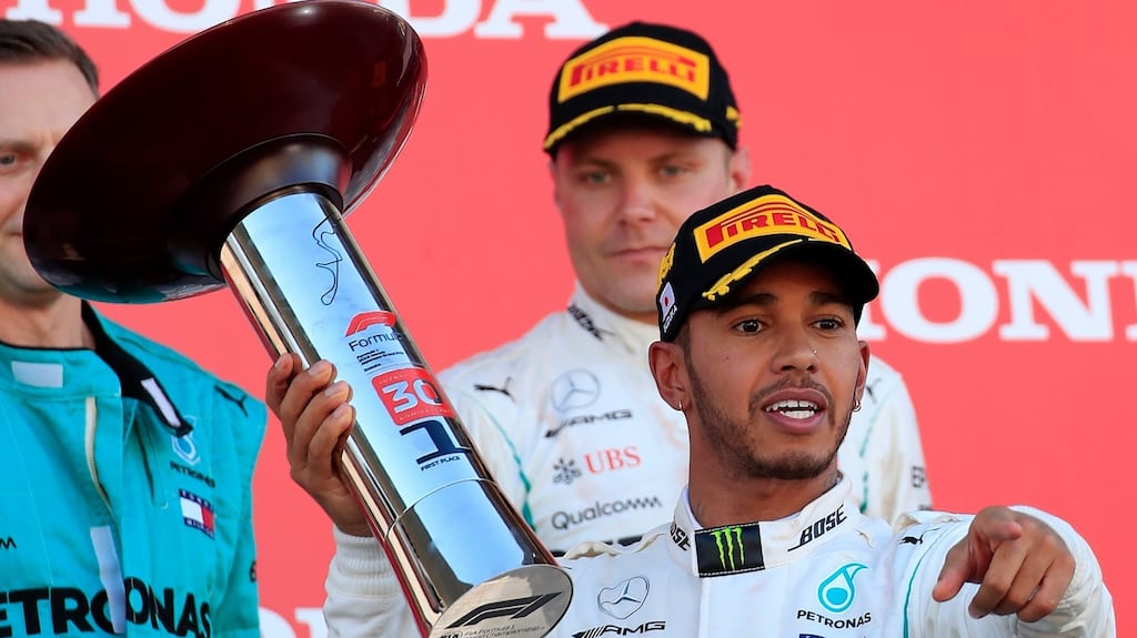 Lewis Hamilton celebrates victory in the Japanese Grand Prix. Photograph: Franck Robichon/EPA