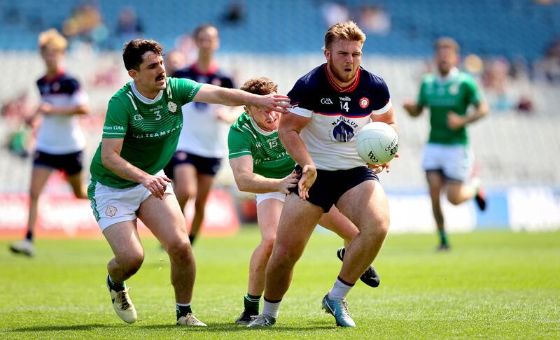 London’s Patrick O'Connor and Brian Coughlan of New York during the junior championship final at Croke Park. Photograph: Ryan Byrne/Inpho 