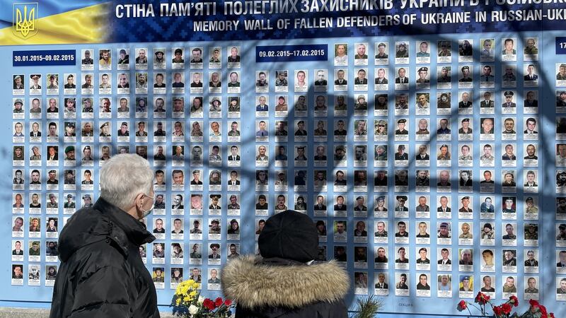 A couple in Kyiv visit a memorial wall for soldiers killed in the country’s eight-year conflict with Russia. Photograph: Daniel McLaughlin