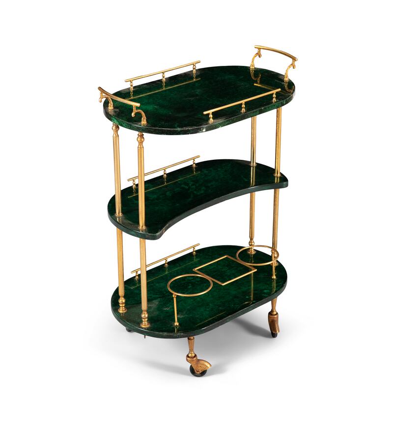 A three-tier drinks trolley with brass detailing lacquered goat skin by Aldo Tura,  €800-€1,200