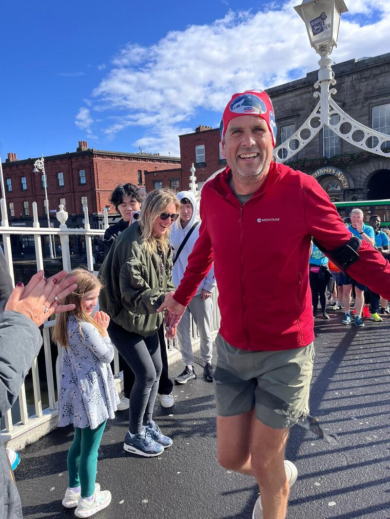 Adharanand Finn crossing the Ha’penny Bridge in Dublin last Friday after running just more than 1,400 miles (2,250km) around Ireland in 68 days