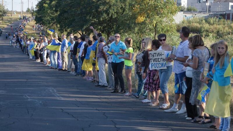 Inhabitants of Mariupol form a human chain in support of Independent Ukraine and against war on the eastern side of Mariupol in the  Donetsk region yesterday. Photograph: Alexander Ermochenko/EPA