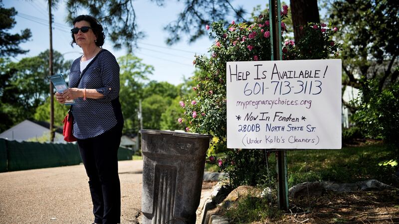 A pro-life activist waits for patients to arrive outside the Jackson Women’s Health Organisation. Photograph:  Brendan Smialowski/AFP via Getty