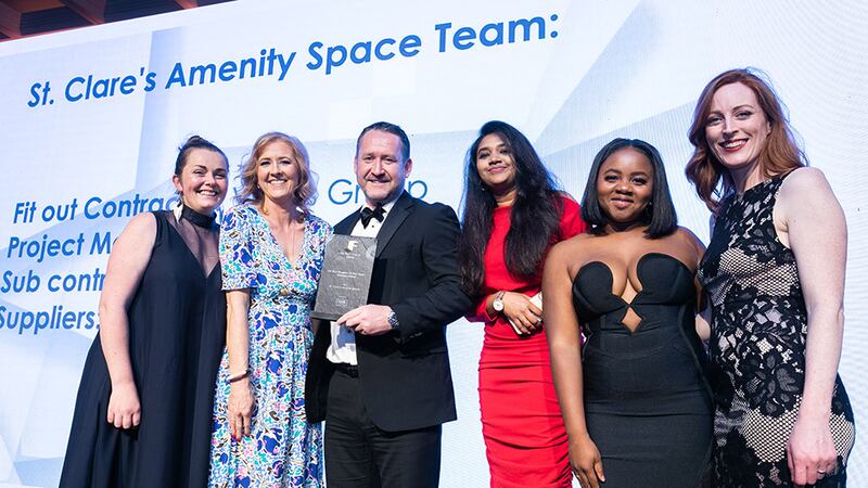 Gary McCloskey, group commercial director, Pure Fit Out, presents the Fit Out Project of the Year – Conservation award to SaulDesign Architecture and Interiors team.