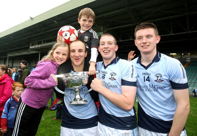 Damien Quigley with his children Emma and Colm, as well as teammates Shane Dowling and Kevin Downes, after Na Piarsaigh won the 2011 Limerick Senior Hurling Championship final. Photograph: Lorraine O'Sullivan/Inpho