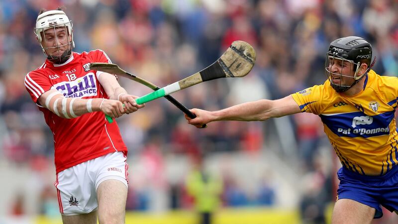 Cork’s Tim O’Mahony is blocked by Clare’s Cathal Malone during the Rebels victory at Páirc Uí Chaoimh. Photograph: Oisín Keniry/Inpho