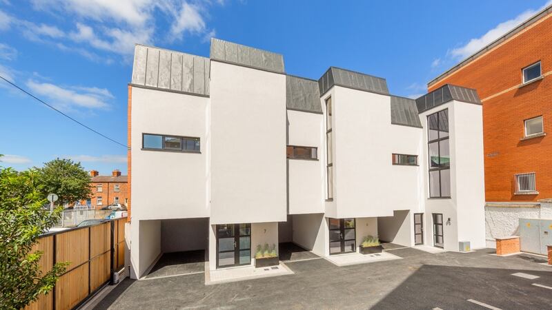 The rear of the houses, overlooking the parking spaces