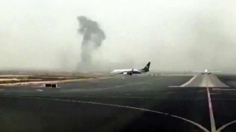This image made from video shows smoke rising after an Emirates flight crash landed at Dubai International Airport on Wednesday, August 3rd, 2016. The plane at right was unaffected Dubai-based airline Emirates has confirmed that there were no fatalities on a flight from India that crash-landed. Photograph:  Hayen Ayari/ AP
