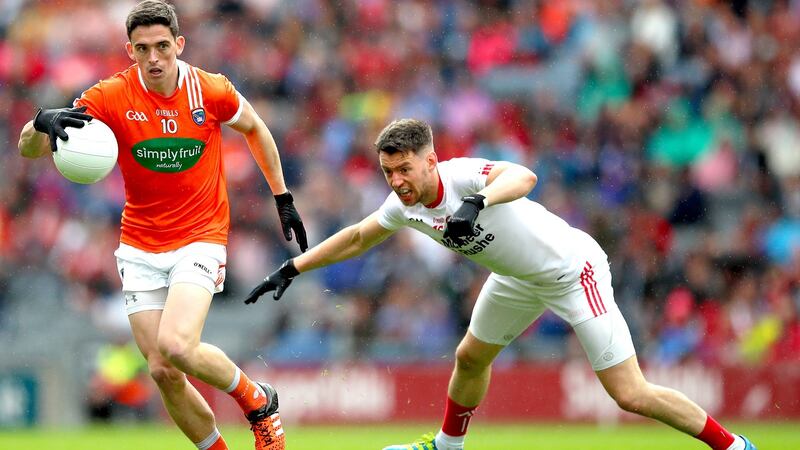 Armagh’s Rory Grugan gets away from  Matthew Donnelly of Tyrone during the All-Ireland SFC quarter-final at Croke Park. Photograph: James Crombie/Inpho