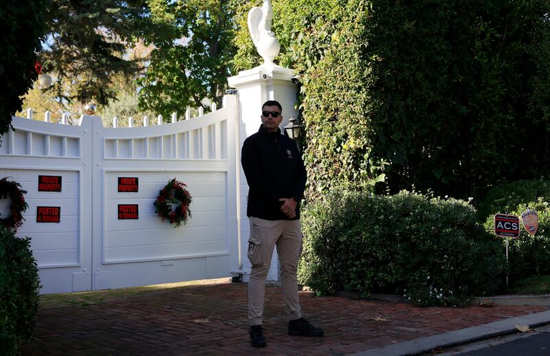 A security guard keeps watch in front of director Rob Reiner's home on December 15th, 2025 in Brentwood, California. Photograph: Mario Tama/Getty Images