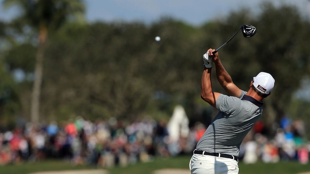 Adam Scott of Australia hits his tee shot on the sixth hole during the third round of the Honda Classic. Photo: Mike Ehrmann/Getty Image