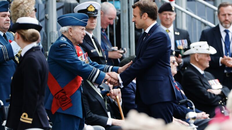 French president Emmanuel Macron shakes hands with a Canadian veteran during a ceremony to mark the 75th anniversary of D-Day, in Portsmouth, England. Photograph: Luke MacGregor/Bloomberg