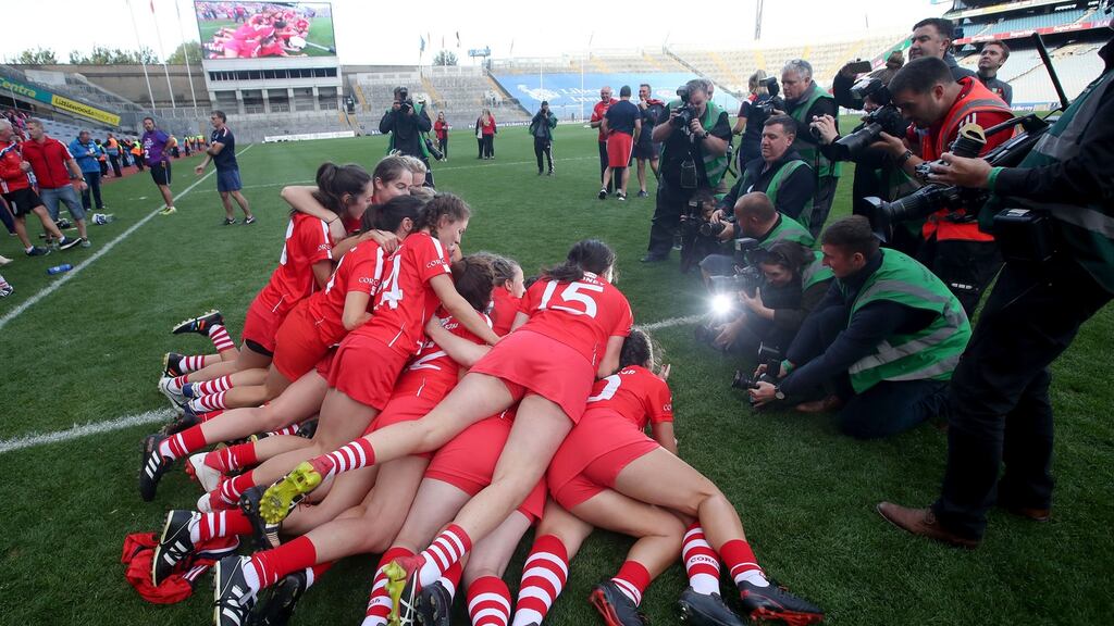 Cork’s players celebrate after winning the camogie All-Ireland. Photograph: Bryan Keane/Inpho