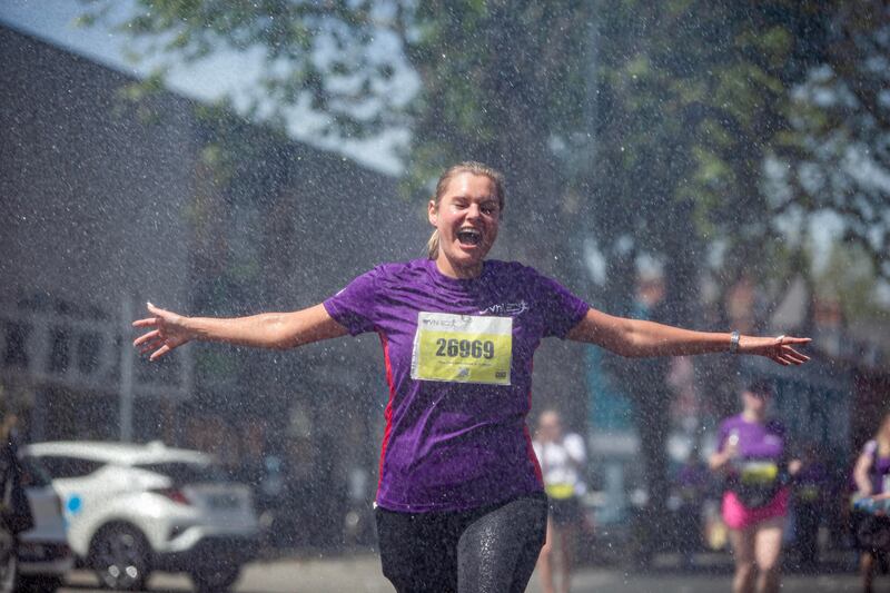 Dublin Fire Brigade cools down runners with water. Photograph: Inpho/Dan Clohessy