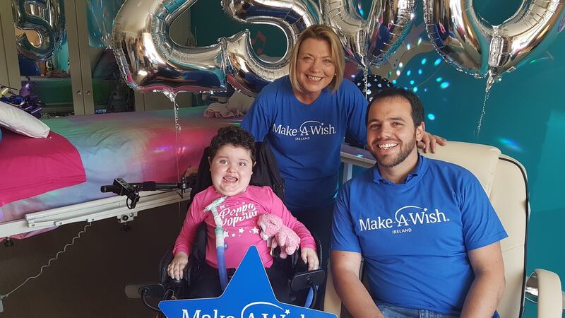 Poppy with Louise Whelan and Liam-Sean Bergin from the Make-A-Wish foundation.