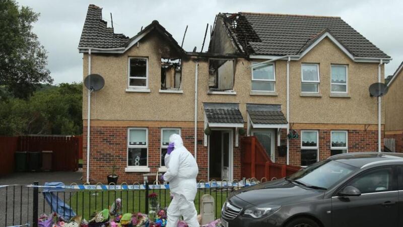 A police forensic officer at the scene of a house fire on Hazel View in Lagmore, Belfast where Jennifer Dornan, 30, was found dead. Photograph: PA
