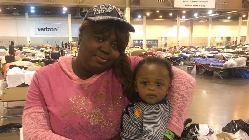 Hurricane Harvey evacuees Tiffany Bernard and her son Que Majesty Ferd at the NRG centre in Houston, Texas.
