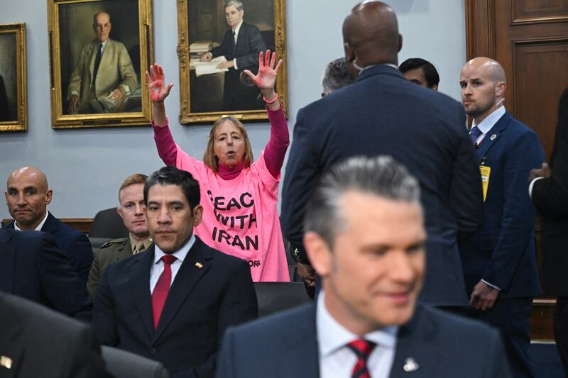 A protester calls for peace with Iran as US secretary of defense Pete Hegseth testifies during a US Senate committee. Photograph:  Saul Loeb/AFP via Getty Images