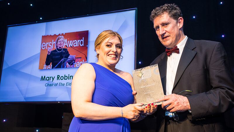 Sharon Doyle, Head of HR at Bord na Móna, presents the Green Leader 2022 award to Minister Eamon Ryan on behalf of Mary Robinson. 