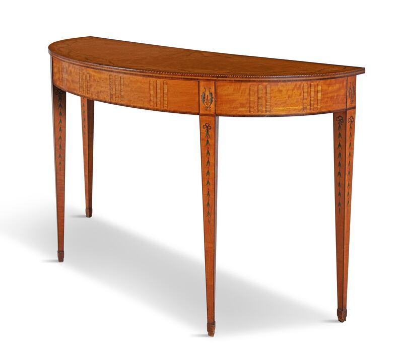 An Irish inlaid D-shaped side table, circa 1780, attributed To William Moore of Dublin, €10,000-€15,000, Adam’s