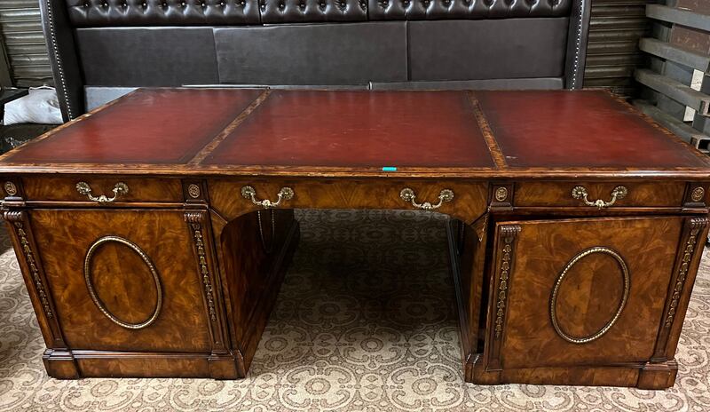 A partner's desk by Theodore Alexander, circa 1900, originally from  Harrods

