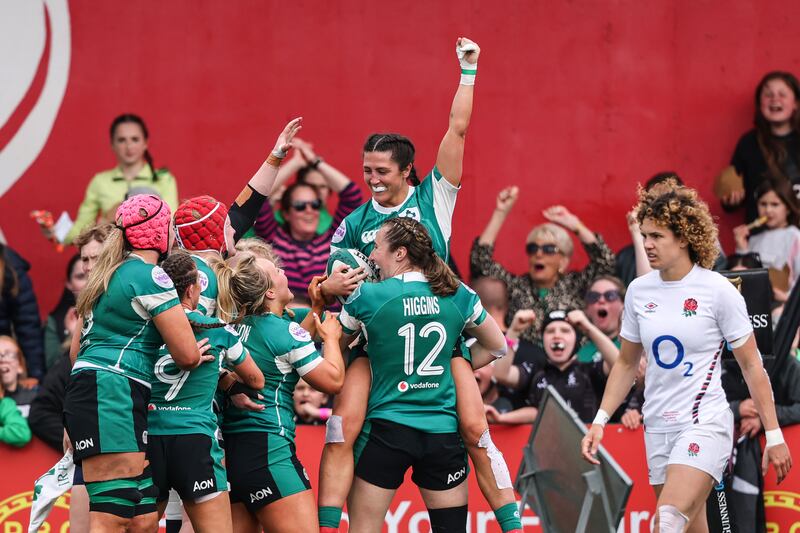 Ireland's Amee-Leigh Costigan celebrates scoring a try with teammates. Photograph: Ben Brady/Inpho